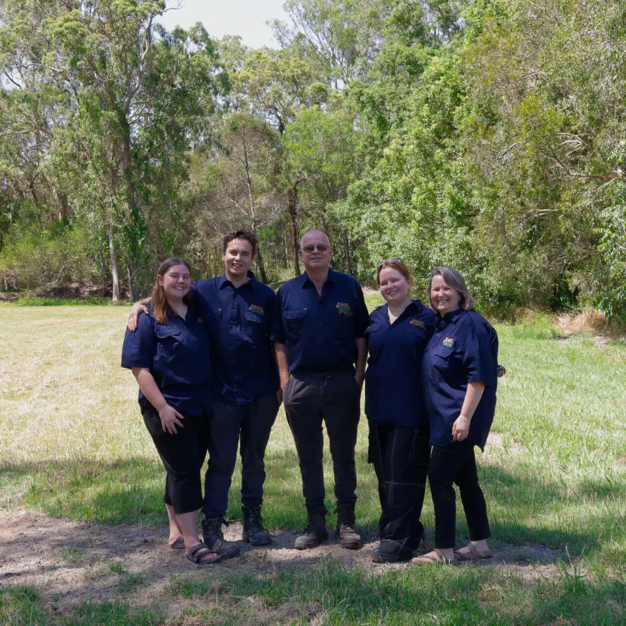 Jimmy and Elaine, owners and founders of Jimel Transport, with the team in Jimel uniforms