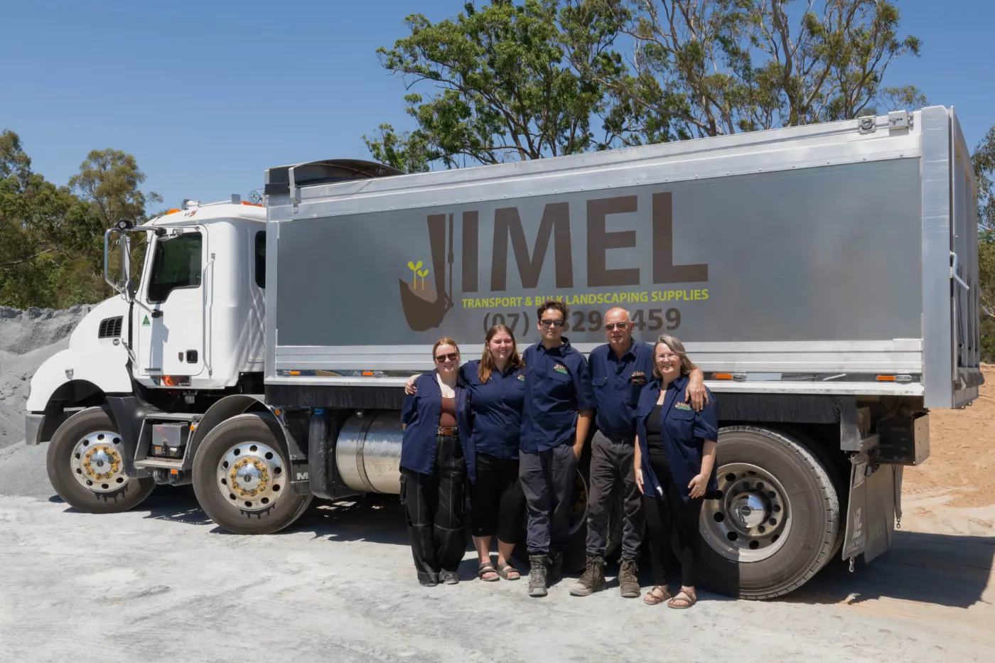 The Jimel Transport team standing in front of a Jimel bulk landscaping supplies tipper truck at the Brisbane yard